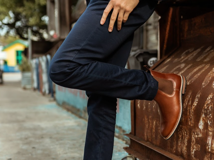 The Finn Brown wearer leaned up against an industrial box on wheels