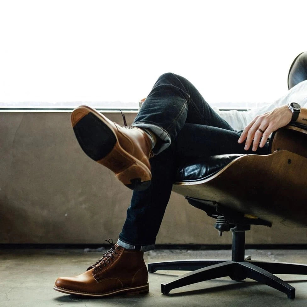 HELM - Man lounging in chair wearing Zind Teak