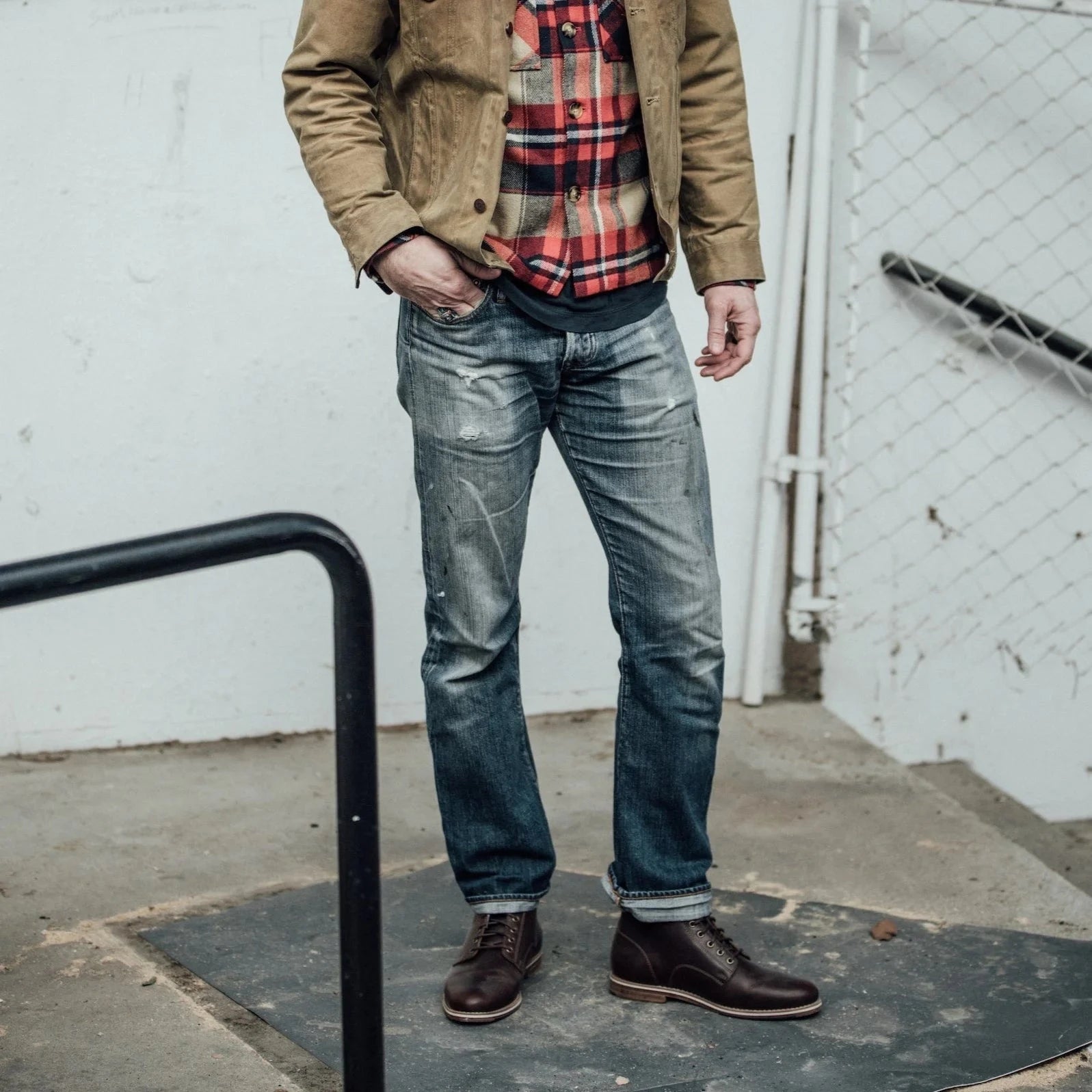 HELM - Man wearing the Zind Brown standing on concrete