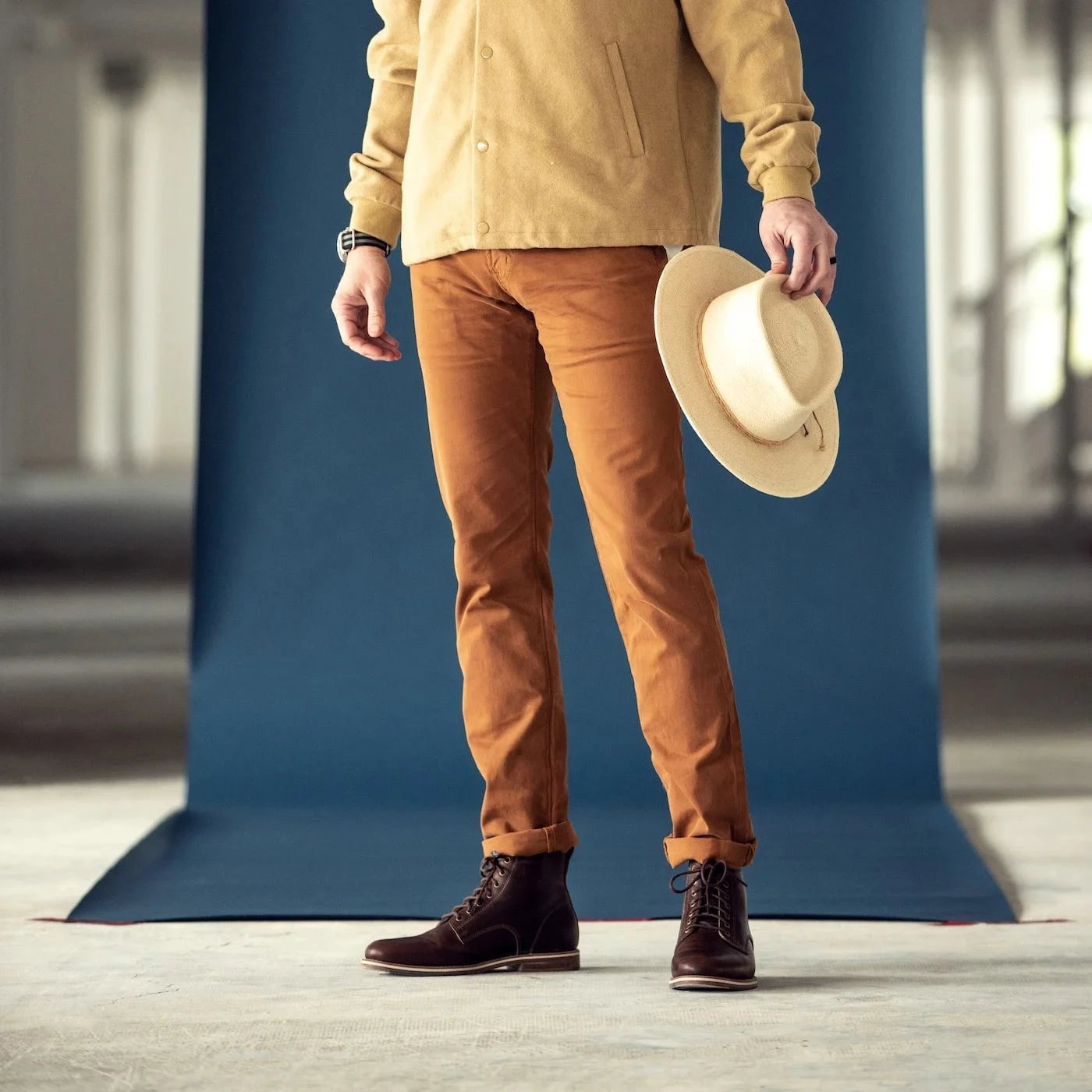 HELM - Man standing in the Zind Brown and orange pants