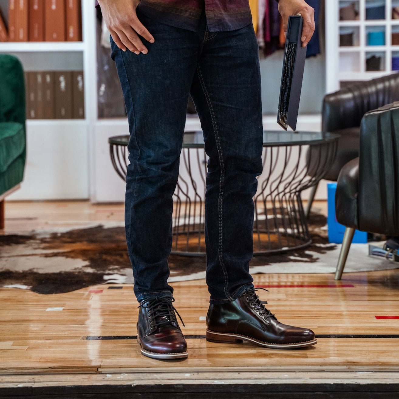 HELM - Man wearing Zind Burgundy standing on wood floors